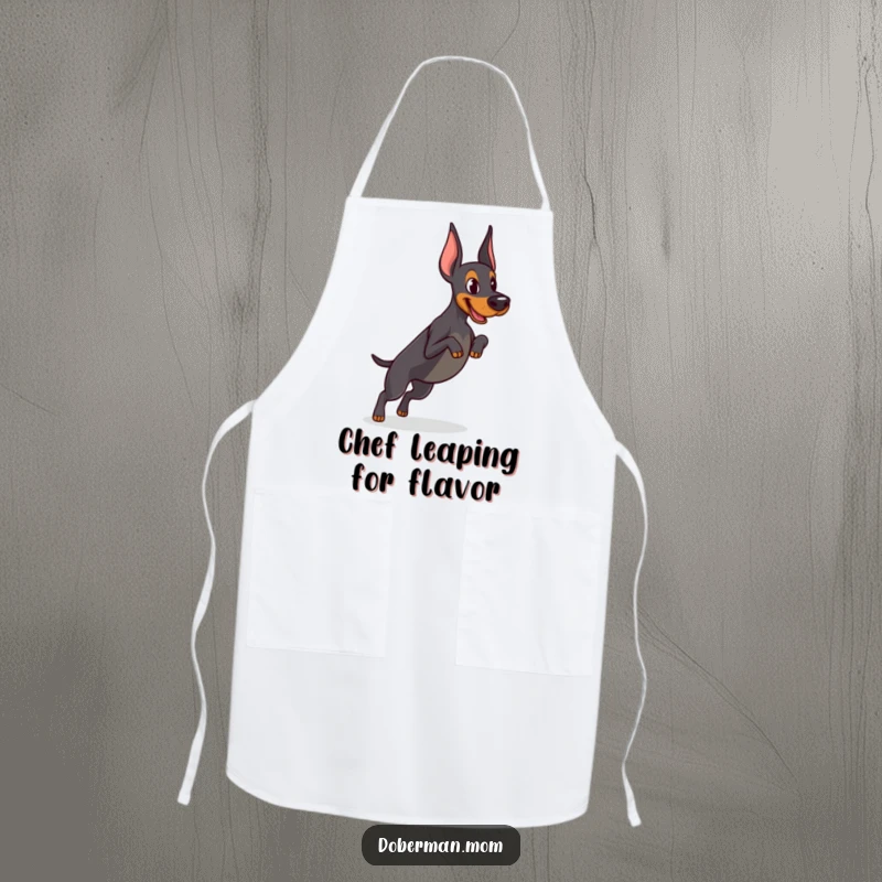 Funny Determined Doberman apron showing focused practice of a tiny jump, adding athletic humor and motivation to kitchen tasks.