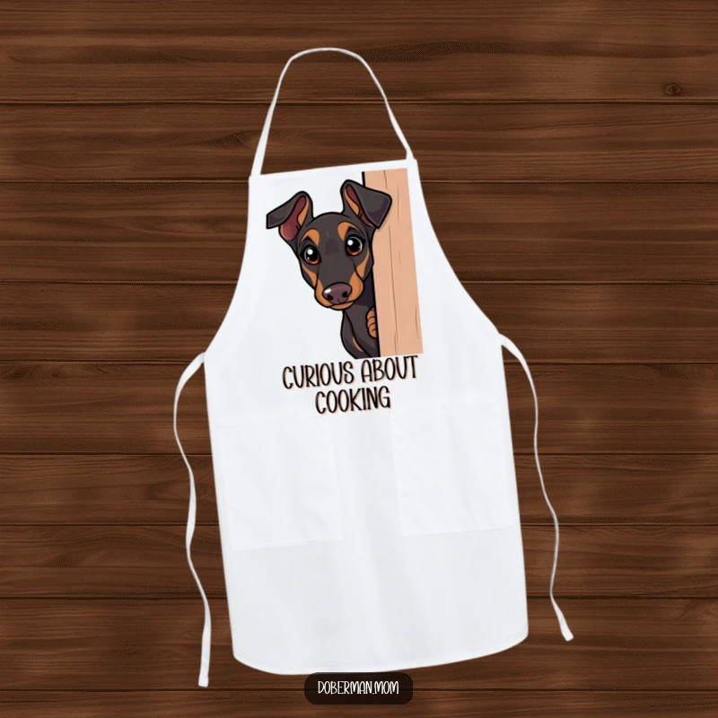 Funny Doberman apron, curious dog peeking around a corner with wide eyes, humorous and intriguing for kitchen activities.