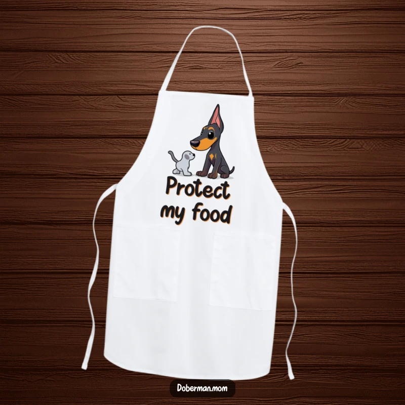 Funny Doberman apron featuring a dog in a protective stance, guarding a toy, ideal for kitchen wear and humor.