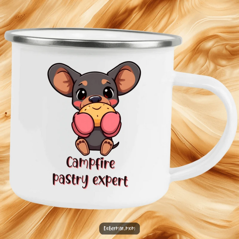 Funny Doberman dog wearing oven mitts, holding a pastry, on a camping mug for outdoor baking enthusiasts.