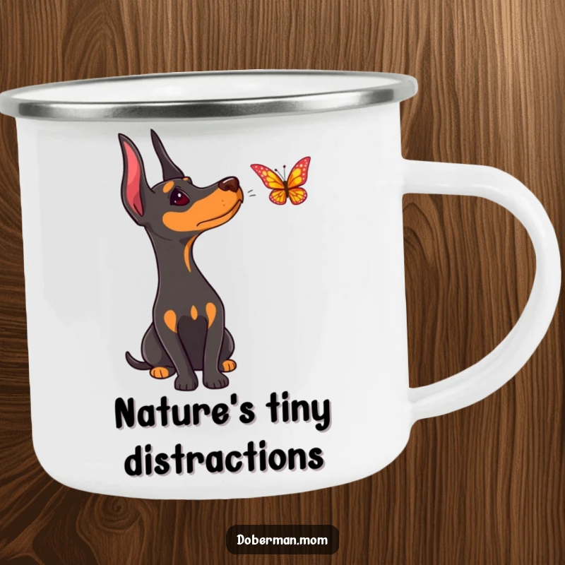 Funny Doberman camping mug, enamel, showing a curious dog with head tilted, watching a butterfly flutter by.