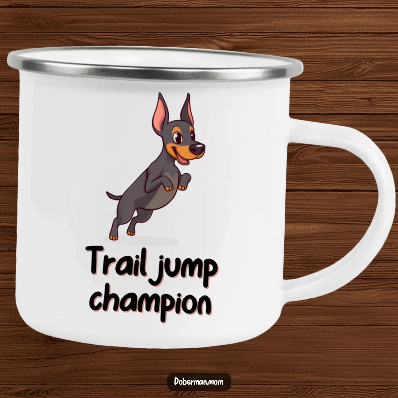 Funny Determined Doberman camping mug showing focused practice of a tiny jump, ideal for outdoor training and motivational drinks.
