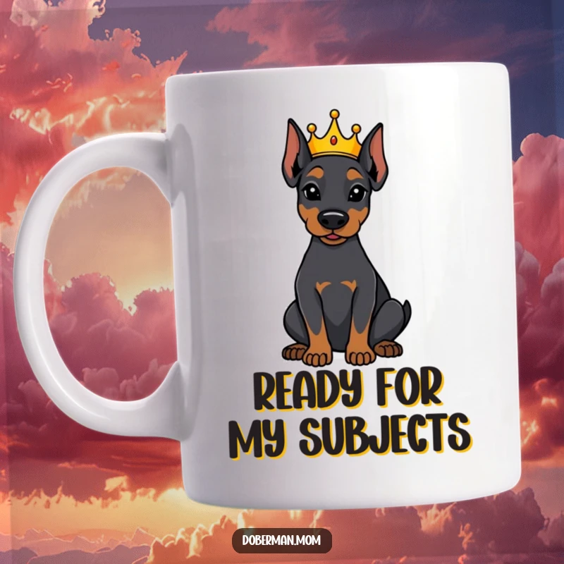 Funny Doberman dog sitting attentively wearing a tiny crown on a mug, symbolizing loyal rule and humorous charm.