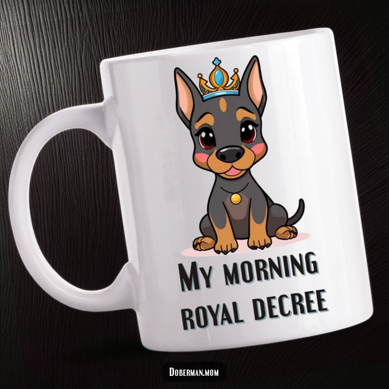 Funny Doberman dog wearing a sparkling tiara, posing like a queen on a regal mug, perfect for dog lovers.