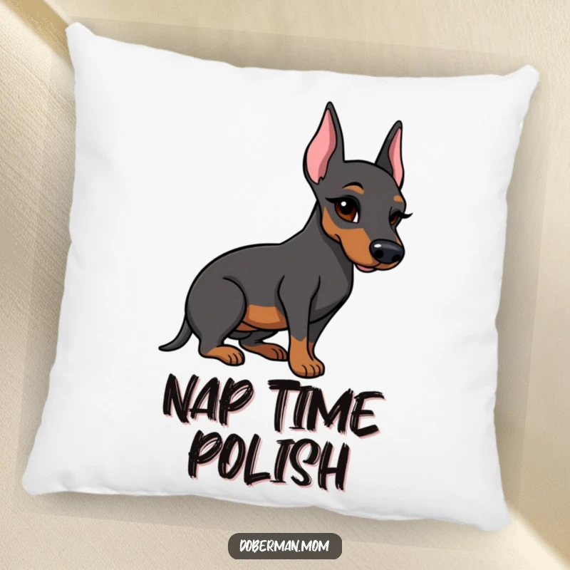 Funny Doberman pillow with a winking dog holding a polished boot, adding a humorous and charming touch.