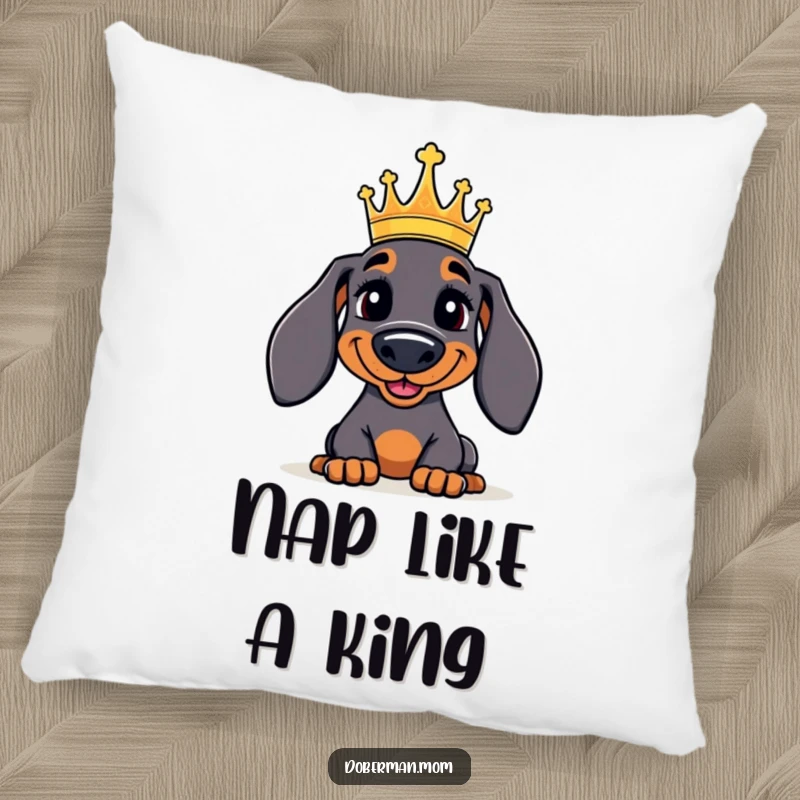 Funny Doberman Pillow: A jolly Doberman dog wearing a small crown, offering plush comfort and regal, humorous appeal.