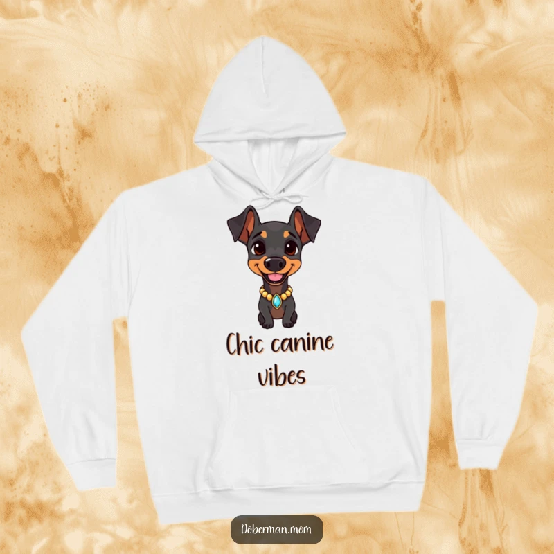 Doberman wearing a jeweled collar, smiling confidently on a cozy hoodie, offering warmth and sophisticated charm.