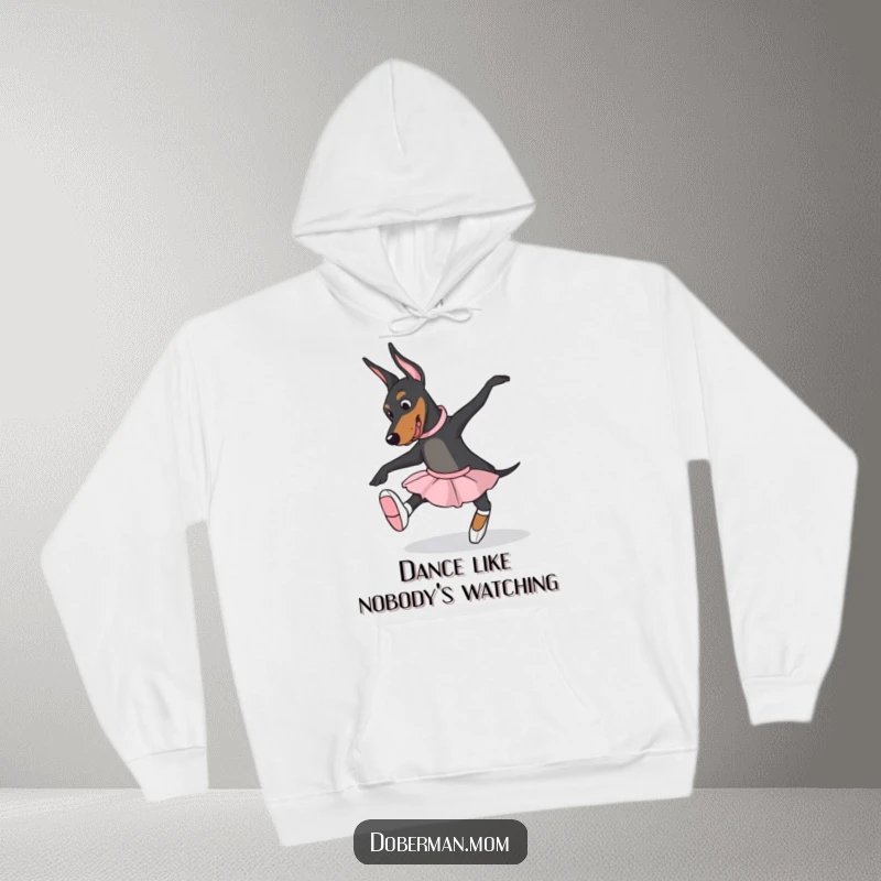 Funny Doberman dog wearing ballet slippers, striking a dance pose on a cozy hoodie, ideal for dance enthusiasts.