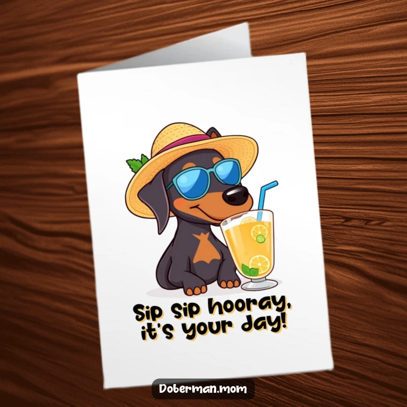 Funny Free Printable Doberman wearing a sun hat sips a cool beverage on a birthday card.