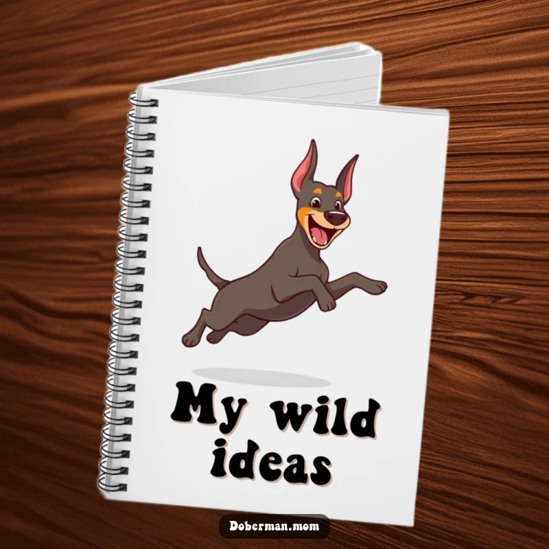 Funny Doberman notebook featuring a cheerful dog in a playful leap, ideal for jotting down energetic and fun ideas.