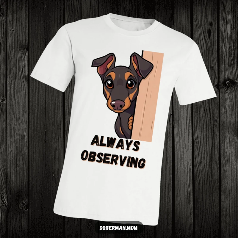 Funny Doberman t-shirt, curious dog peeking around a corner with wide eyes, conveying intrigue and playful mischief.