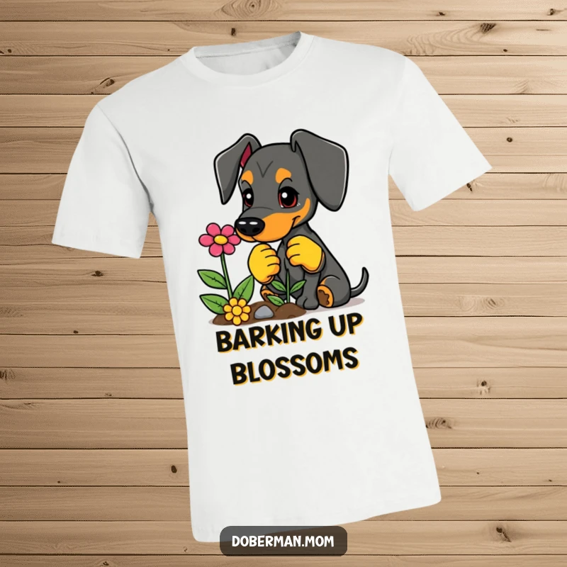 Funny Doberman t-shirt, sporting gardening gloves, planting a colorful flower, a playful gardener.