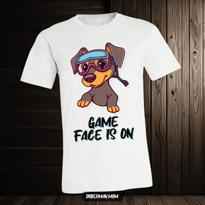 Funny Sports Doberman T-Shirt: A Doberman sporting miniature sports goggles, exuding readiness for athletic play.