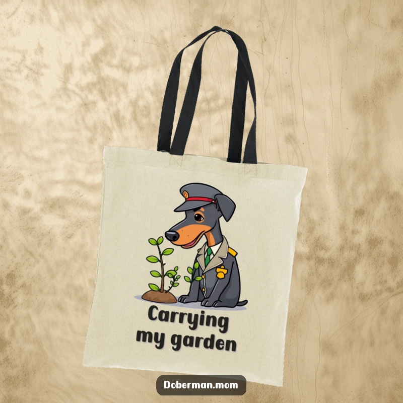 Uniformed Doberman carefully tending a small sapling on a durable and funny tote bag.