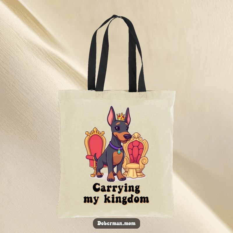 Funny Doberman tote bag showing a proud Doberman with a tiny crown and miniature throne, perfect for carrying royal decrees.