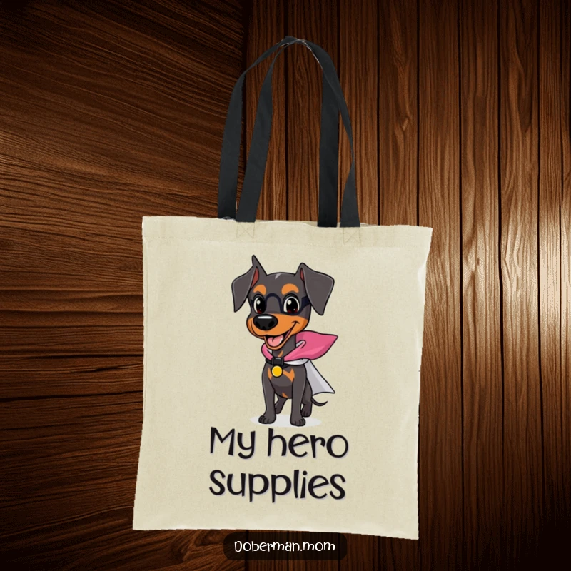 Funny Doberman tote bag with a happy dog wearing a small superhero cape, ready for action and errands.